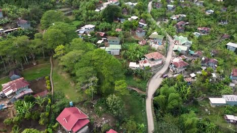 Aerial-footage-of-dirt-road-in-remote-village-in-Tetepan,-Sagada,-Mountain-Province,-Philippines-using-DJI-Mini-2
