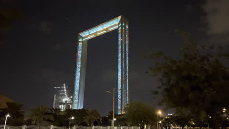 Slow-moving-shot-of-The-Frame-of-Dubai-at-night