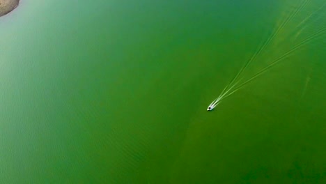 isolated-speed-boat-running-on-lake-water-from-top-angle-video-is-taken-at-umiyam-lake-shillong-meghalaya-india