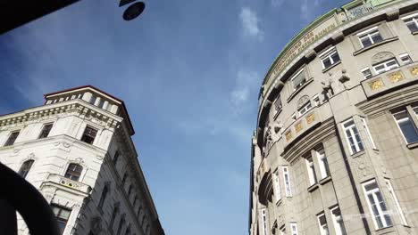 Looking-out-a-car-window-at-the-beautiful-historic-buildings-of-Vienna,-Austria