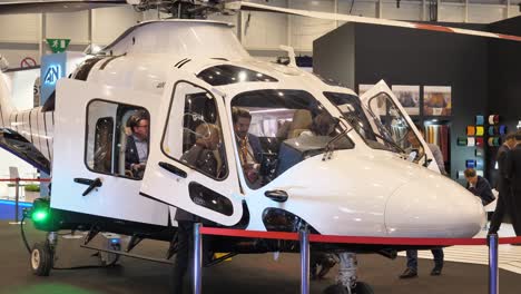 People-inside-Agusta-VIP-helicopter,-EBACE,-Geneva