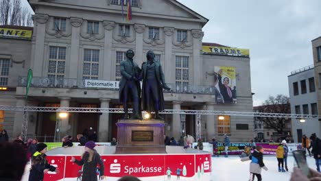 Goethe-and-Schiller-Monument-in-Weimar-with-Kids-doing-Ice-Skating