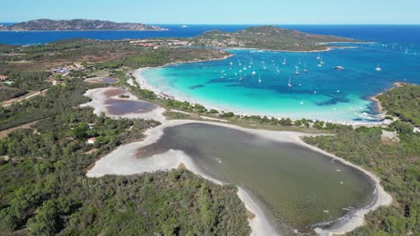 Brandinchi-Beach,-Salt-Lakes-and-Turquoise-Blue-Bay-in-San-Teodoro,-Sardinia---4k-Aerial