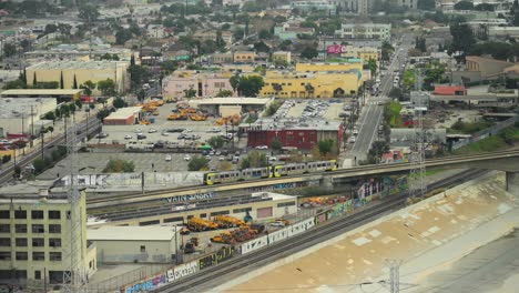 Train-Crossing-the-LA-River-in-the-day-time,-inland