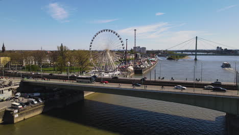 Aerial-Pan-of-Cologne-Deutz-Suspension-Bridge-and-Ferris-Wheel-Germany