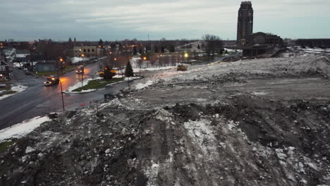 Buffalo-snowplows-remove-and-pile-up-snow-From-Streets-and-sidewalks-After-Extreme-winter-blizzard-on-Dec-of-2022