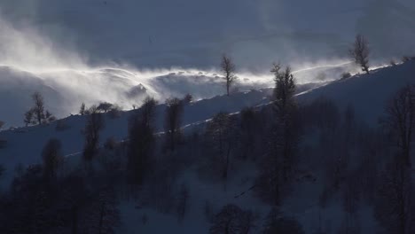 Slow-motion-Time-lapse-moving-freezing-cold-ice-fog-clouds-on-the-top-of-the-hills-in-Iran-highlands-in-Winter-in-Iran-Dry-bare-trees-in-nature-in-a-sunny-day-middle-east-Asia-in-winter-Travel-trip