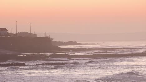 amazing-sunrise-over-some-small-waves-breaking-on-the-coast-of-Estoril-near-Lisbon-in-Portugal