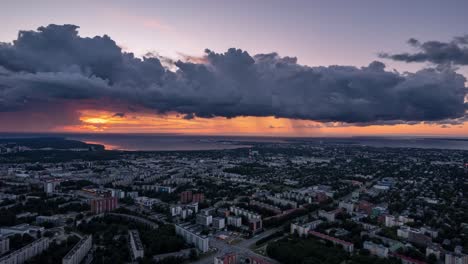Sensational-aerial-drone-view-of-Tallinn-cityscape-in-Estonia,-sunset,-hyperlapse