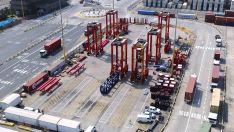 Aerial-shot-of-saddle-cranes-in-a-shipping-container-yard-in-Durban-Harbour