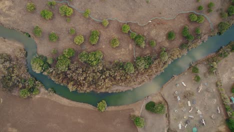 Top-down-drone-shot-of-the-Rio-De-La-Jara-on-Spain's-coast