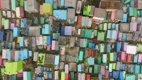 Top-down-aerial-that-moves-over-the-colorful-graves-in-a-cemetery