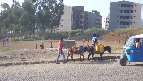 Africa-morning-playing-football-bring-water-and-start-transport-all-in-one-shot