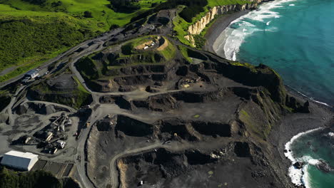 Excavating-volcanic-rock-in-open-pit-Blackhead-quarry,South-Island,-New-Zealand