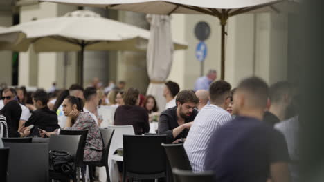 Static-slow-motion-shot-of-outside-restaurant-serving-in-Turin