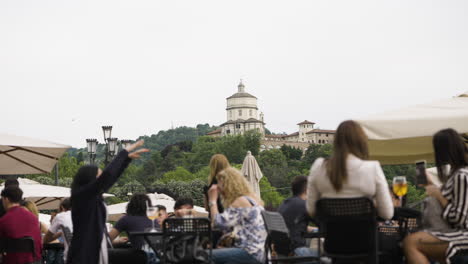 Out-of-focus-Italian-outdoor-seating-with-Chiesa-di-Santa-Maria-in-focus-from-afar