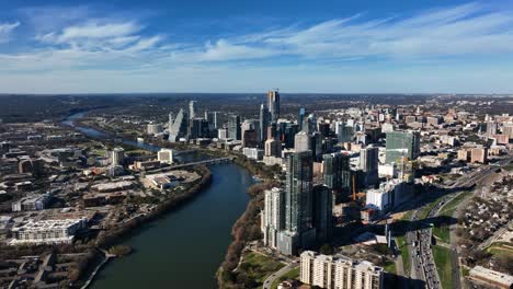 City-of-Austin-on-a-sunny-autumn-day-in-south-USA---wide,-panoramic,-aerial-view