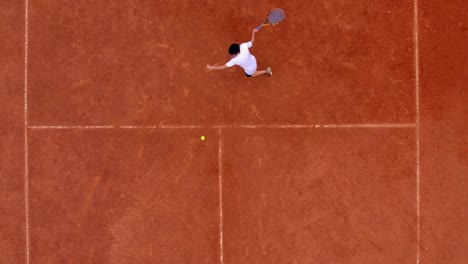 Slow-Motion-Of-Tennis-Player-Practicing-On-Tennis-Court,-Hitting-Ball-Hard
