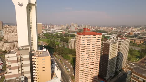 Aerial-drone-shot-through-Durban-City-Centre-with-the-Southern-sun-Hotel