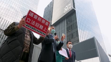 Pro-China-supporters-gather-outside-the-Legislative-Council-headquarters,-also-known-as-Legco,-as-they-celebrate-the-HKSAR-government's-policy-of-reforming-the-electoral-system