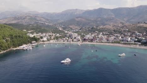 Aerial-panoramic-shot-of-Himare-Coastline,-a-Travel-destination-with-turquoise-seascape,-Albania