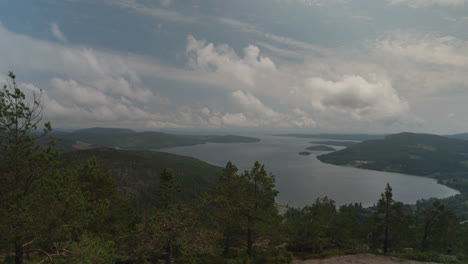 Summer-View-of-High-Coast-Sweden-from-Skuleberget,-panning-shot-of-landscape-from-mountain-top