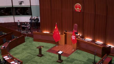 View-of-the-Chinese-emblem-is-seen-above-the-People's-Republic-of-China-flag-at-the-main-chamber-of-the-Legislative-Council-building-known-as-Legco-in-Hong-Kong