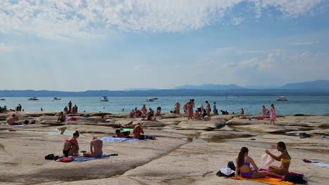 Eye-level-shot-of-tourists-in-the-beach