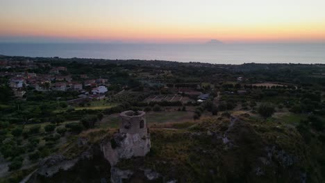 Stromboli-Aeolian-Islands-Sunset-View-from-Vibo-Valentia,-Capo-Vaticano,-Calabria,-Italy---Aerial-4k