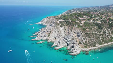 Capo-Vaticano-Cliff,-Blue-Mediterranean-Sea-and-Coastline-in-Calabria,-South-Italy---Aerial-4k