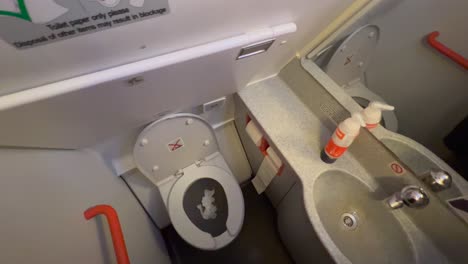Easyjet-bathroom-toilet-on-an-airplane,-small-space,-4K-shot