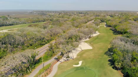 Aerial-view-of-wooded-area-with-a-road-running-through-it-on-Amelia-Island