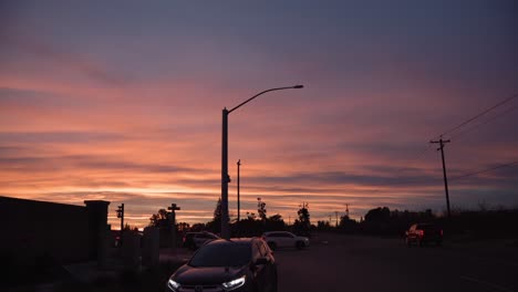 A-pastel-sky-over-a-country-road-intersection-after-the-rain-in-Clovis,-CA,-USA
