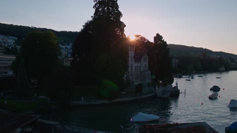 Droneshot-of-an-old-Villa-at-a-lake