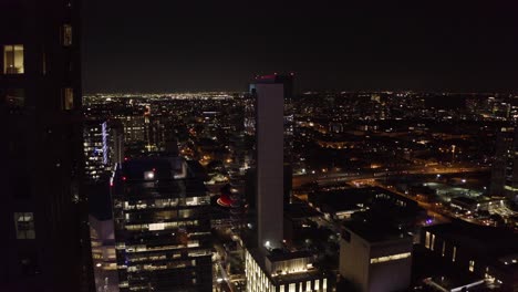 Aerial-view-of-the-downtown-Dallas,-Texas-skyscrapers-lit-up-at-night
