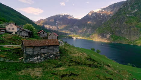 Picturesque-village-on-the-edge-of-a-fjord-in-Norway---sliding-aerial-reveal