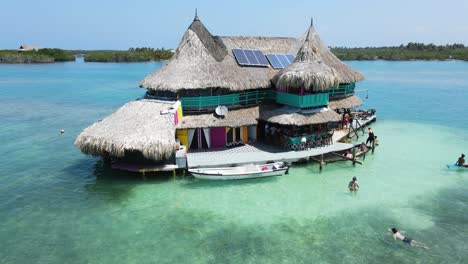 Columbia-Tourists-at-Vacation-Villa-on-Island-in-San-Bernardo-Archipelago,-Aerial-Orbit