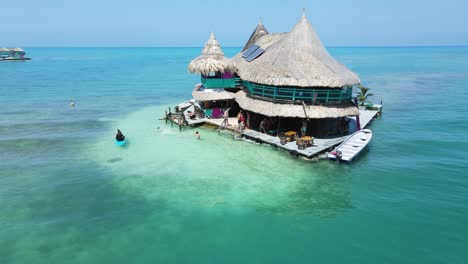 People-on-Tropical-Vacation-on-Island-in-Columbia-Caribbean,-Aerial-Orbit