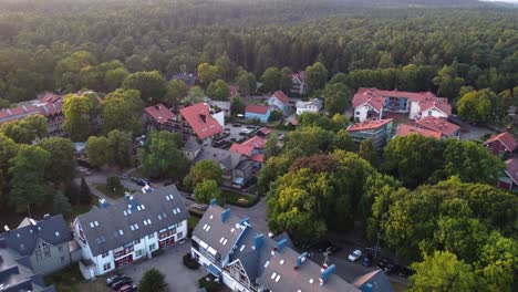 AERIAL-Backwards-Fly-By-over-a-Resort-Town-Juodkrante-in-Lithuania