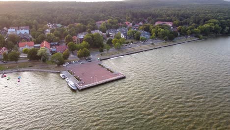 AERIAL-Orbiting-Shot-of-a-Resort-Town-Juodkrante-Harbor-in-Lithuania