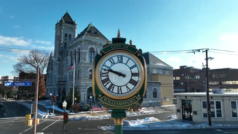 Slow-aerial-orbit-around-City-of-Williamsport-clock-in-center-city