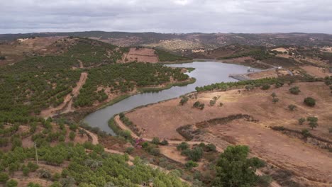 Aerial-wide-panoramic-view-of-water-reservoir-in-Rural-landscape,-Alentejo
