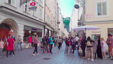 Pedestrian-zone-and-shopping-street-in-the-heart-of-Salzburg,-Austria,-a-famous-tourist-attraction
