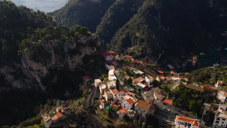 Lush-Amalfi-mountain-valley-town-aerial-view-rising-over-idyllic-Italian-village-landscape