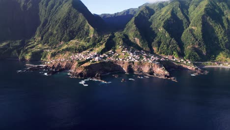 Aerial-landscape-of-epic-green-mountain-ridge-coast,-Madeira,-tilt-up