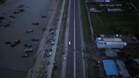 4k-Drone-shot-of-car-moving-on-a-road