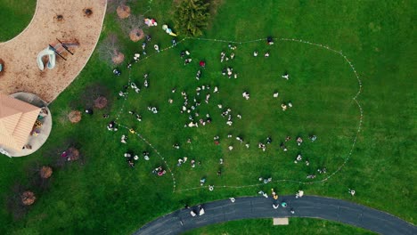 top-down-aerial-of-easter-egg-hunt-event-at-a-large-park-in-Plainfield-Illinois