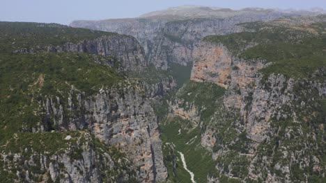 An-aerial-view-pass-with-a-drone-through-one-of-the-largest-gorges-in-Europe,-Vikos-gorge-in-Greece