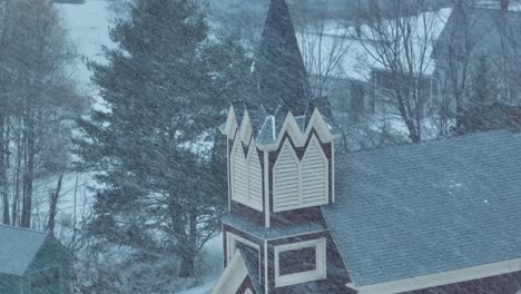 Aerial-snowfall-around-Swedish-Lutheran-Church-in-Monson