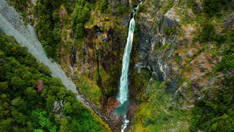New-Zealand-Drone-Aerial-of-Devil’s-Punchbowl-Waterfall,-Camera-Pan-Down